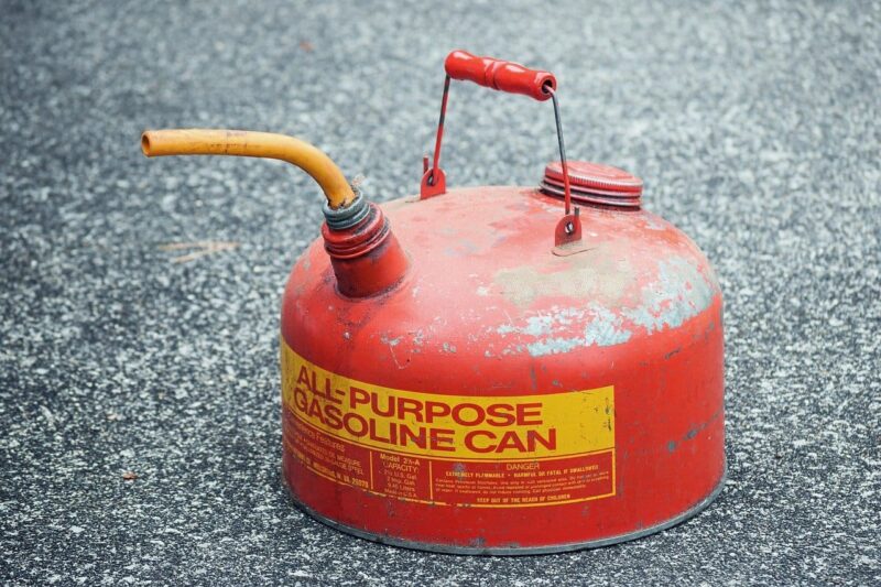 Gas can on the ground used for emergency fuel delivery