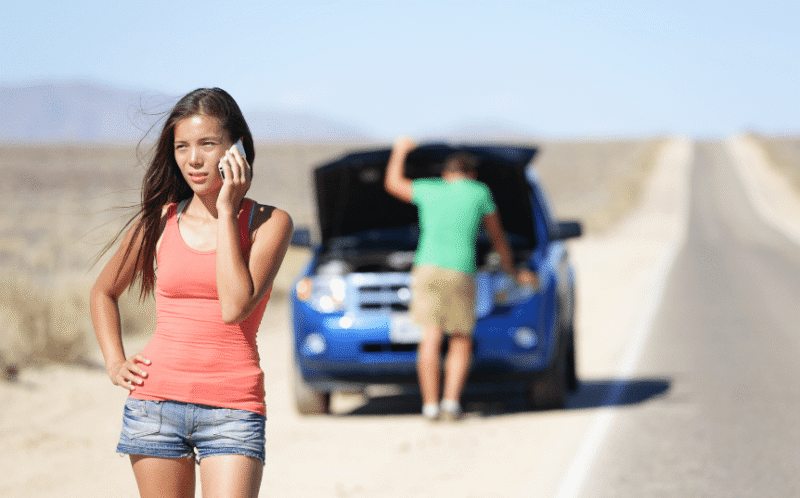 Hoist Towing Contact Info car broke down one person at vehicle with hood up and another calling for towing