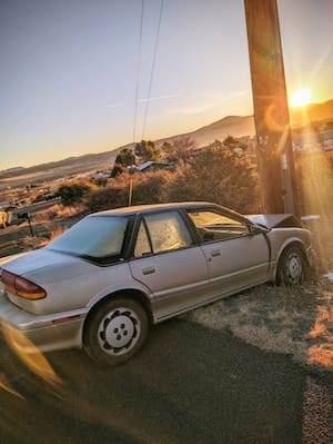 Hoist Towing accident recovery towing in Chino Valley gold car hit power pole